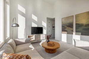 Living room featuring a high ceiling