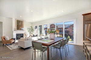 Dining space with dark wood-type flooring and a wealth of natural light