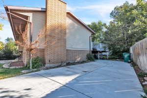 View of property exterior featuring a deck