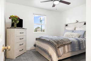 Carpeted bedroom with ceiling fan