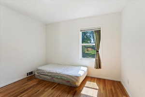 Bedroom featuring hardwood / wood-style floors