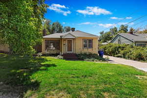 Bungalow-style home featuring a front yard