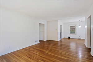 Unfurnished living room with hardwood / wood-style flooring