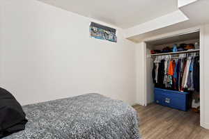 Bedroom featuring a closet and hardwood / wood-style flooring