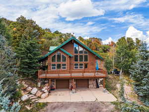 Log-style house with a garage