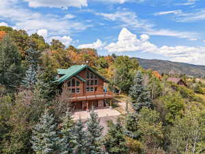 Rear view of house featuring a mountain view