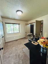 Interior space featuring a textured ceiling