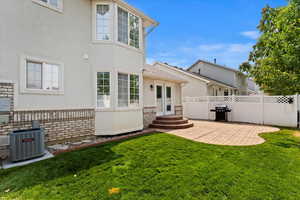 Fully fenced backyard with patio