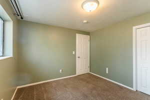 Carpeted spare room with a wealth of natural light