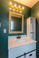 Bathroom featuring vanity and a textured ceiling