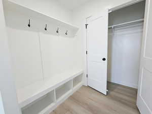 Mudroom featuring light wood-type flooring