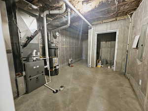 Basement featuring secured water heater