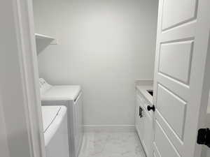 Indoor laundry room with washer and dryer hook ups (appliances NOT included). Cabinetry shown is Not in place. Subject to negotiation..