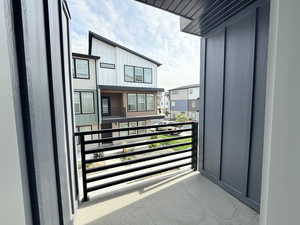 Second floor balcony provides outside access from living room.