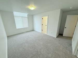 Spacious primary bedroom with spacious walk-in closet
