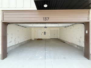 Two car attached garage featuring SMART garage door opener