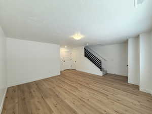 First floor living room with wood-style flooring