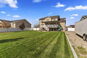 Exterior space featuring a deck and a lawn