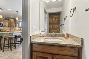 Bathroom with vanity and tile patterned floors