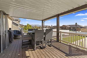 Wooden deck featuring area for grilling