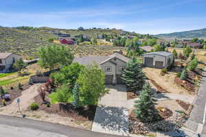 Aerial view of home with open space beyond