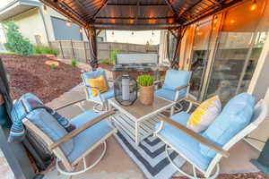 Covered patio and hot tub