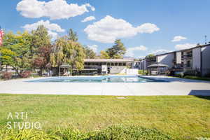 View of pool featuring a patio area, a yard, and a gazebo