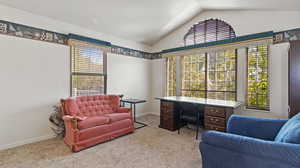 Interior space featuring vaulted ceiling and a healthy amount of sunlight