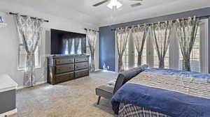 Bedroom with carpet flooring and ceiling fan