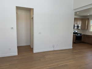 Interior space with light wood-type flooring and a textured ceiling