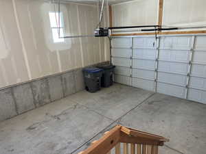 Garage featuring a garage door opener