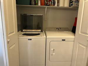 Clothes washing area with washing machine and clothes dryer