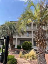 View of side of property featuring a balcony