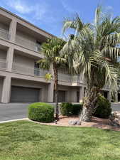 View of building exterior featuring a garage