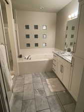 Bathroom with separate shower and tub and vanity