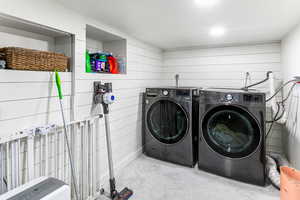 Laundry room with washer and clothes dryer