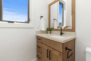 Bathroom featuring vanity and toilet