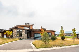 View of front facade featuring a garage