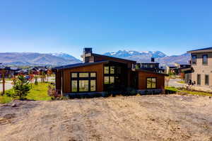 Rear view of property featuring a mountain view