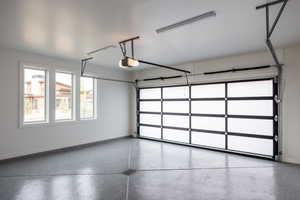 Garage featuring a garage door opener