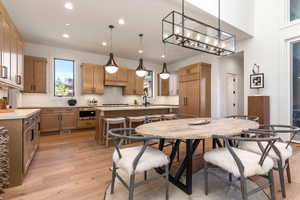 Dining room featuring a chandelier, light hardwood / wood-style floors, and sink