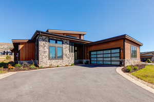 View of front facade featuring a garage