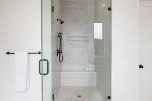 Bathroom with a shower with shower door