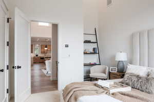 Bedroom with wood-type flooring