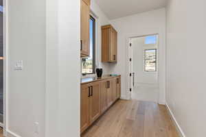 Hallway with light wood-type flooring