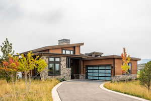 View of front facade featuring a garage