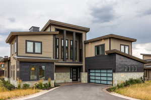 Contemporary home featuring a garage