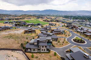 Birds eye view of property with a mountain view