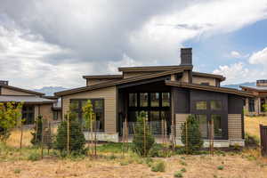 Rear view of house with a mountain view