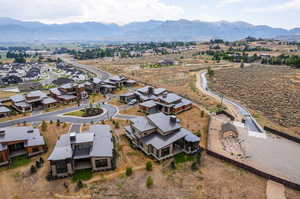 Birds eye view of property with a mountain view